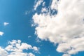 Beautiful white fluffy clouds slowly float against the blue sky on a warm sunny summer day. Timelapse video of cloud movement high