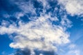 Beautiful white fluffy cumulus and cirrus clouds in a deep blue sky Royalty Free Stock Photo