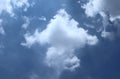 Beautiful white fluffy cumulus clouds on deep blue skies background Royalty Free Stock Photo