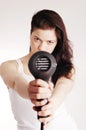 Beautiful white girl drying her hair with a hairdr Royalty Free Stock Photo