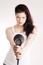 Beautiful white girl drying her hair with a hairdr Royalty Free Stock Photo