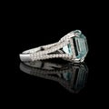 Beautiful white gold ring with diamonds and aquamarine on a black background Royalty Free Stock Photo