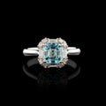 Beautiful white gold ring with diamonds and aquamarine on a black background Royalty Free Stock Photo