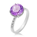 Beautiful white gold ring with large amethyst and small cubic zirconias, isolated