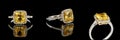 Beautiful white gold ring with yellow sapphire and diamonds on a black background Royalty Free Stock Photo