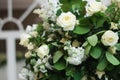 Beautiful White and Green Flower Decoration Arrangement on Wedding Table Golden Support . Wedding Bridal Flower Decoration.