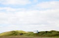 Beautiful white house against cloudy sky in Iceland. Royalty Free Stock Photo