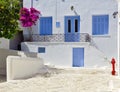 Beautiful white house with blue windows Royalty Free Stock Photo