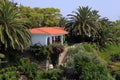 Beautiful white house in the mediterranean garden(Greece). Royalty Free Stock Photo