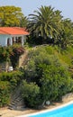 Beautiful white house, pool and tropical garden(Greece). Royalty Free Stock Photo