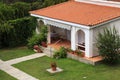 Beautiful white house with small terrace in the garden. Royalty Free Stock Photo