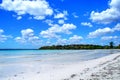 Beautiful white island beach and blue cloudy sky Royalty Free Stock Photo