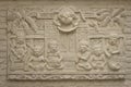 Beautiful white Java stucco patterned on the boundary wall. Vintage white wall bas-relief stucco in plaster, depicts Lotus flower Royalty Free Stock Photo