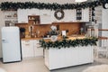 Beautiful white kitchen decorated for Christmas. Christmas holidays Royalty Free Stock Photo