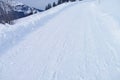 Beautiful white landscape, high mountains Swiss Alps, wide alpine winter road cleared, large snowdrifts on the side, Healthy