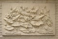 Beautiful white lotus stucco patterned on the boundary wall. Vintage white wall bas-relief stucco in plaster, depicts Lotus Royalty Free Stock Photo