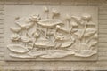Beautiful white lotus stucco patterned on the boundary wall. Vintage white wall bas-relief stucco in plaster, depicts Lotus Royalty Free Stock Photo