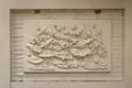 Beautiful white lotus stucco patterned on the boundary wall. Vintage white wall bas-relief stucco in plaster, depicts Lotus Royalty Free Stock Photo