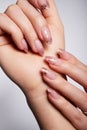 Beautiful white manicure with glitter. Nude manicure Royalty Free Stock Photo