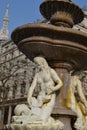 Beautiful white marble ancient two mermaids fountain in Milan.