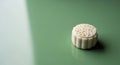 Beautiful white mooncake on a stylish green surface Royalty Free Stock Photo