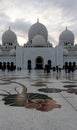 Beautiful white Mosque of Sheikh Zayed with the three huge domes and floral floors