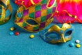 Beautiful white and multicolor carnival masks on a blue background. Purim, Mardi Gras. Top view Royalty Free Stock Photo