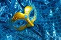 Beautiful white and multicolor carnival masks on a blue background. Purim, Mardi Gras. Top view Royalty Free Stock Photo