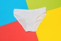 Beautiful white panties on a background of four colors. Minimal concept of women`s underwear Royalty Free Stock Photo