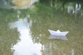 Beautiful white paper boat on water outdoors, space for text Royalty Free Stock Photo