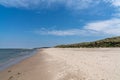 Beautiful white sand beach with high grassy sand dunes behind