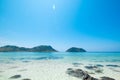 Beautiful white sand beach with island in summer time concept t Royalty Free Stock Photo