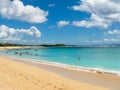 Beautiful white sand beach surrounded by tropical palm trees on the island of Bali in Nusa Dua area. Royalty Free Stock Photo