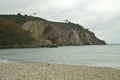 Beautiful White Sand Shore On Artedo Beach Surrounded By High Cliffs. Royalty Free Stock Photo