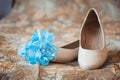 Beautiful white shoes from bride with garter Royalty Free Stock Photo