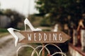 Beautiful white shoes on wooden arrow with wedding text sign. ru Royalty Free Stock Photo