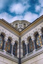 Beautiful white stone church with gold cupolas , blue sky with clouds