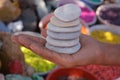 Beautiful white stones pebbels in hand background Royalty Free Stock Photo