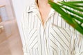 Beautiful white striped woman blouse shirt fashion details close up. minimal comfortable trendy fashion style.