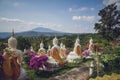 beautiful white stucco Buddha statue enshrined on the hillside It is a place of meditation called Wat Sutesuan. Royalty Free Stock Photo