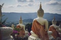 beautiful white stucco Buddha statue enshrined on the hillside It is a place of meditation called Wat Sutesuan. Royalty Free Stock Photo