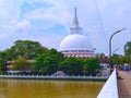 Beautiful White Stupa Beside Lake and Bridge in Sri Lanka Royalty Free Stock Photo