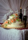 Beautiful white wedding cake decorated with sweet roses Royalty Free Stock Photo