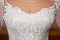 Beautiful white wedding dress with embroidery close-up shot Royalty Free Stock Photo