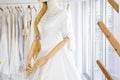 Beautiful white wedding dress on mannequin in shop
