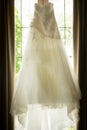 Beautiful White Wedding Dress in a window Royalty Free Stock Photo
