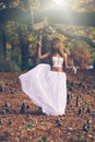 Beautiful wiccan girl dancing in the mystical forest Royalty Free Stock Photo