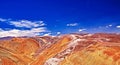 Beautiful wide lonely endless colorful sandstone mountain landscape, blue sky - Cordillera Copiapo, Chile