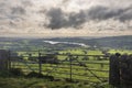 Beautiful wide vista landscape image of English countryside in Peak District National Park late afternoon early Autumn Royalty Free Stock Photo