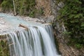Beautiful wide waterfall falling in rocky nature